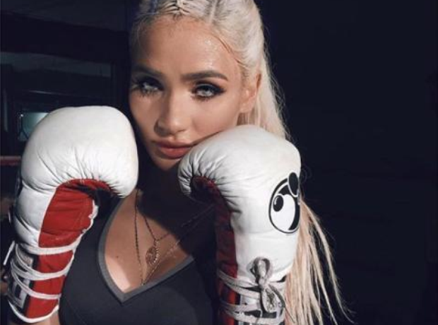 Pia Mia wearing boxing gloves.