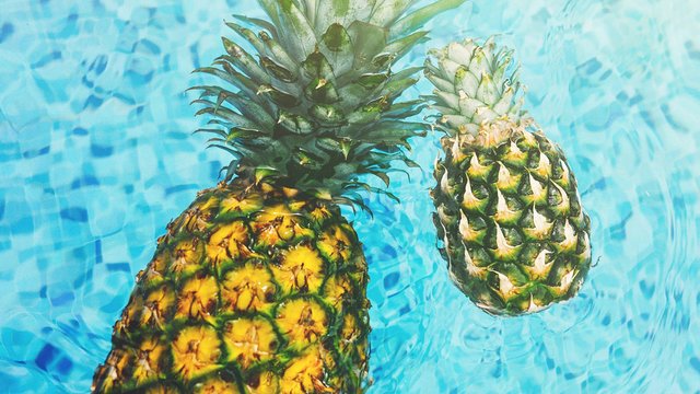 Pineapples in swimming pool